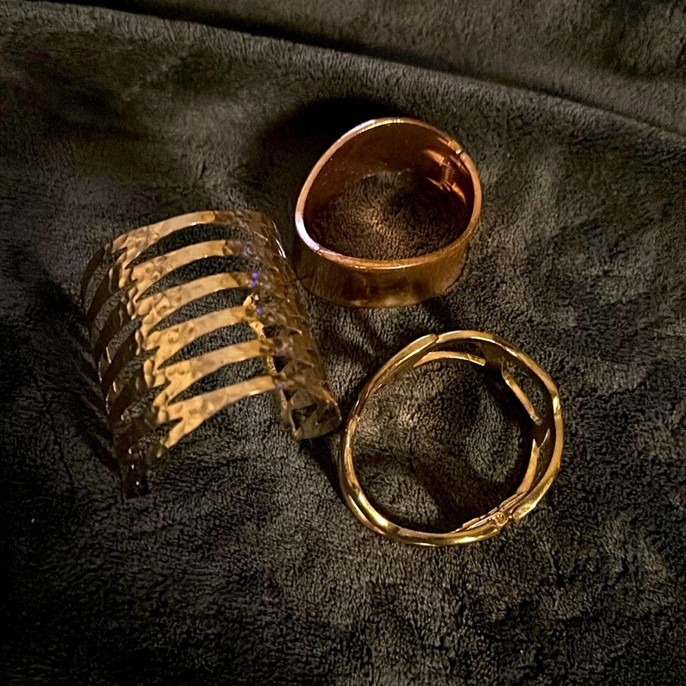 3 bracelets, 2 gold toned and 1 rose gold